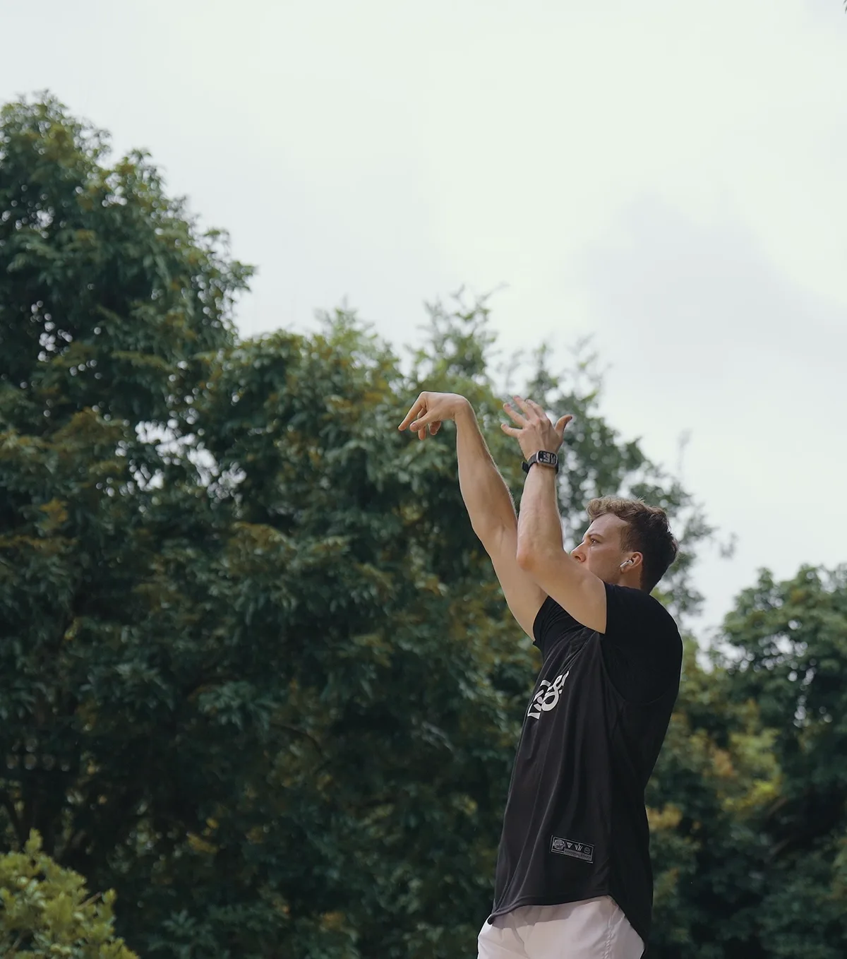 A jump shot released against open sky